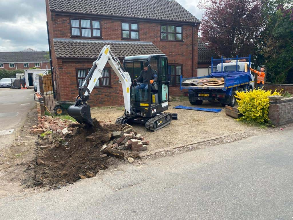 This is a photo of an operative of Isleham Driveways Digging out for a new tarmac driveway