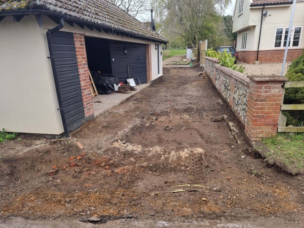 This is a tarmac driveway that is in the process of being dug out and installed by Isleham Driveways